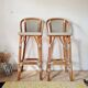 Pair of vintage Gatti bar stools in two-tone rattan and caning.