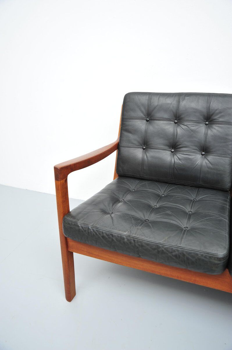 Senator sofa with black leather cushions by Ole Wascher for France and Son