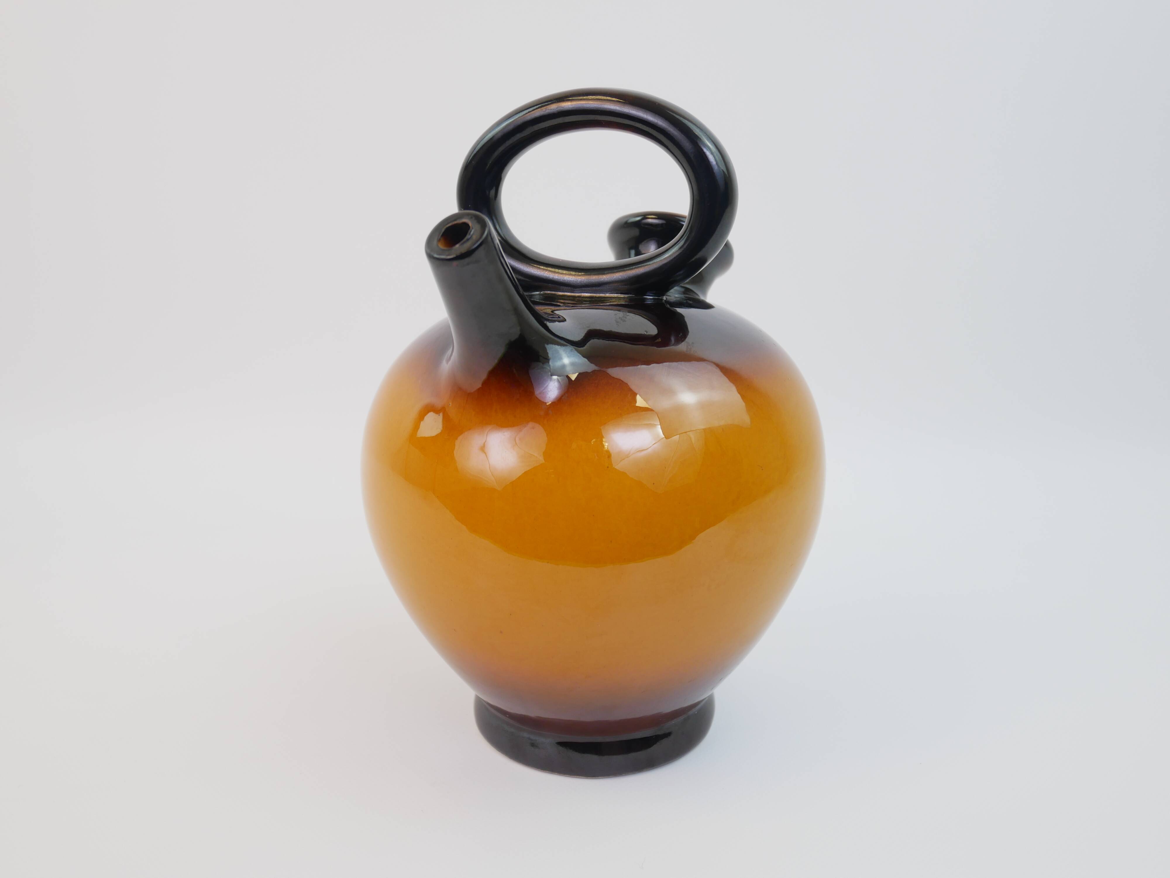 Ochre-orange ceramic jug signed under the base CP Claude Paci