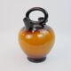 Ochre-orange ceramic jug signed under the base CP Claude Paci