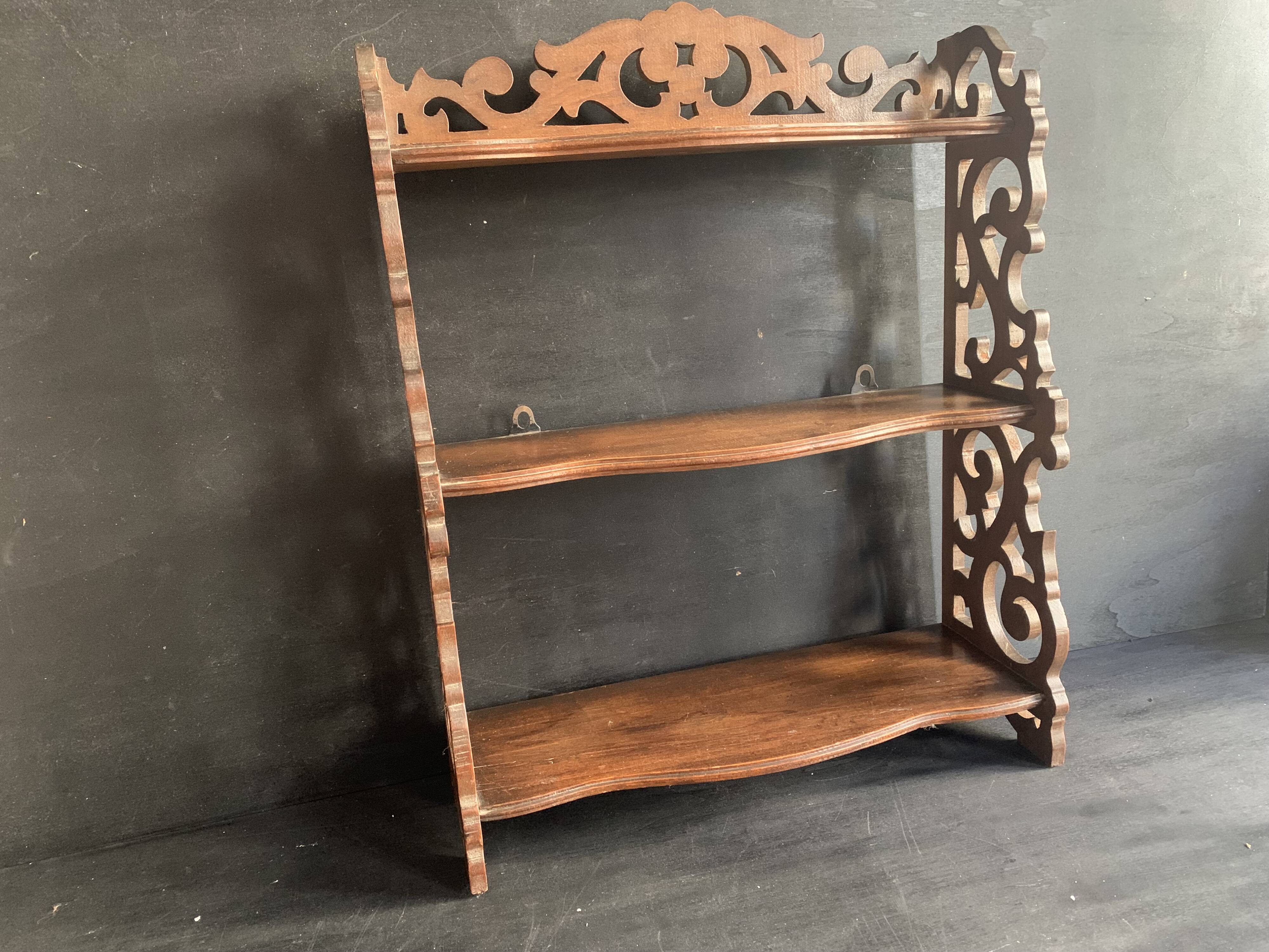 Antique shelf with openwork wooden pediment, early 20th century