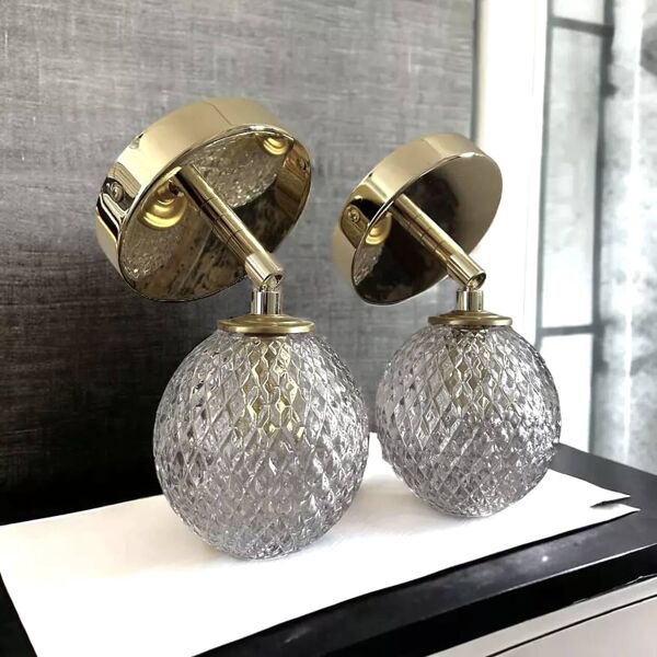 Paire d’appliques murales globes ciselés