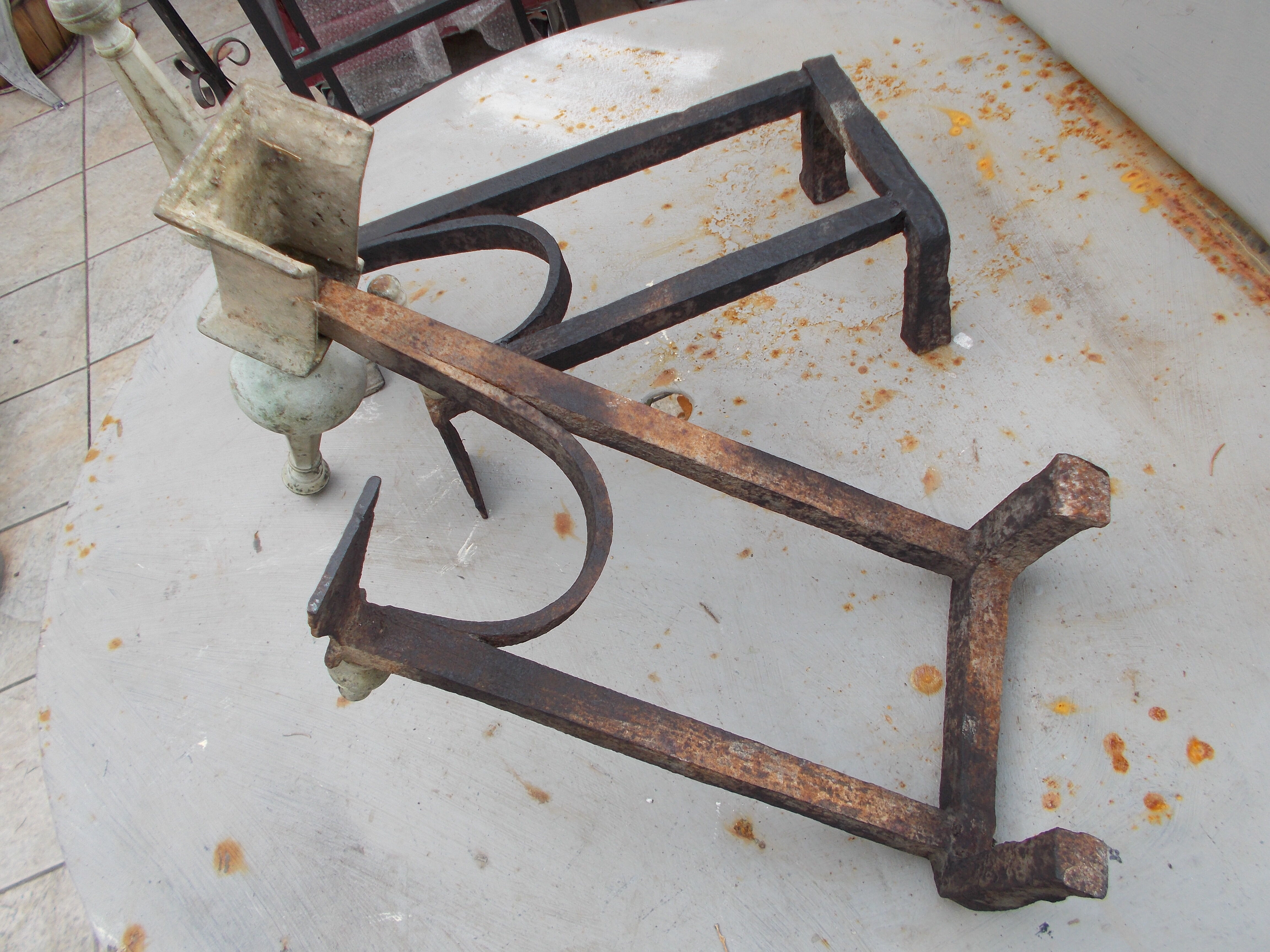 Old pair of wrought iron and bronze pegs