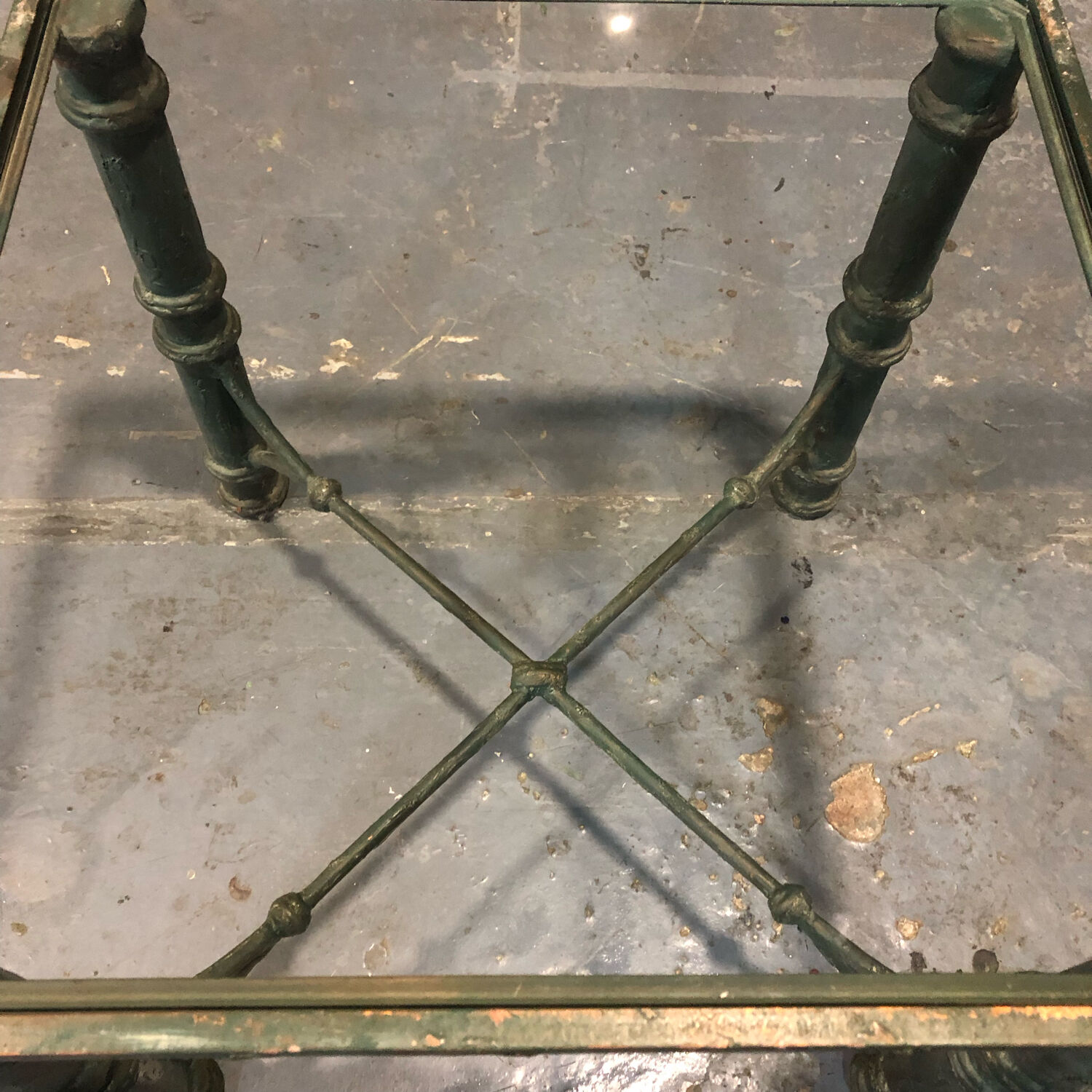 Iron and glass side table with antique patina