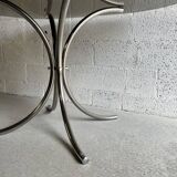 Oval table in smoked glass and chrome steel