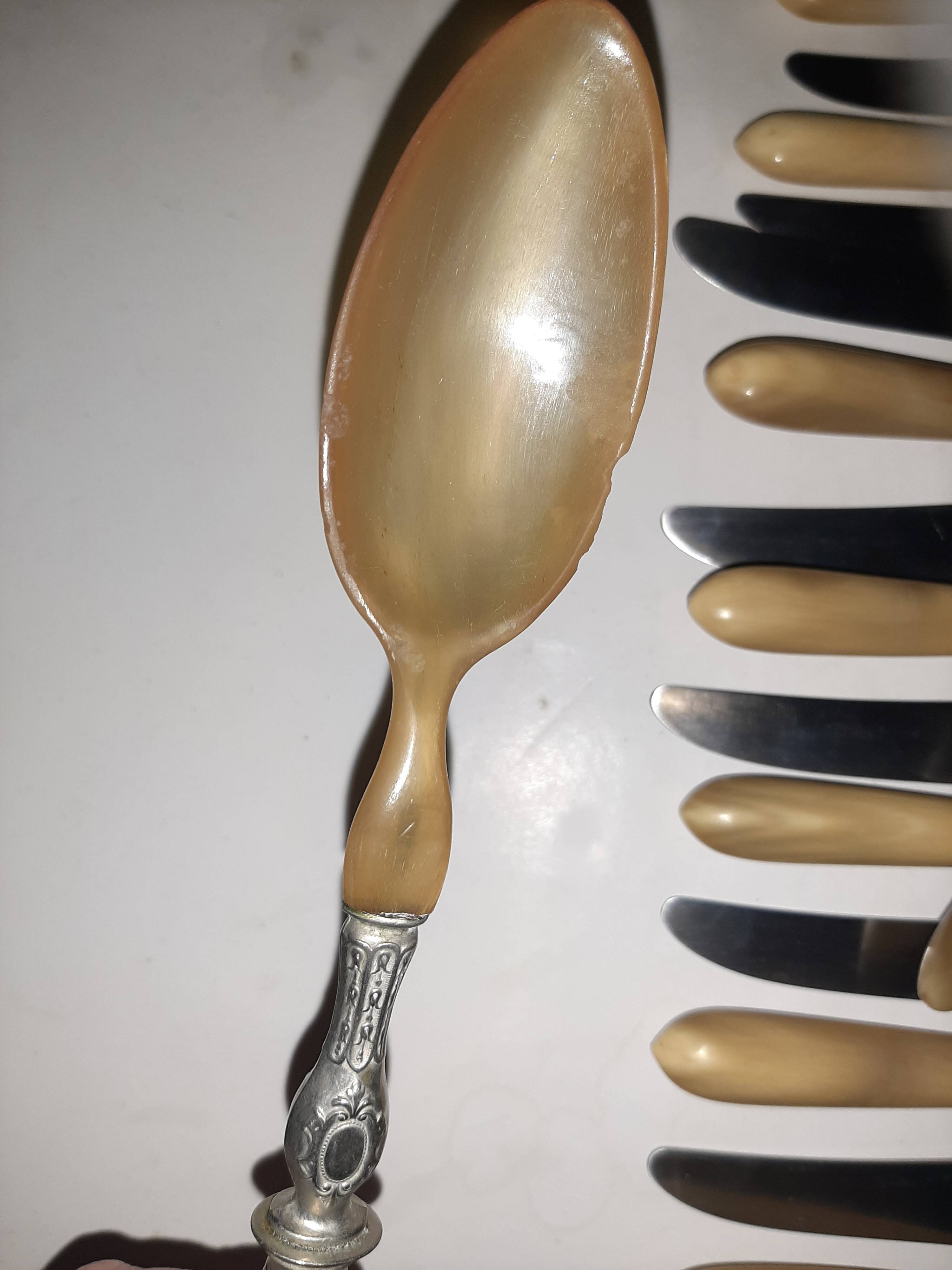29-piece horn cutlery set, knives and serving utensils.