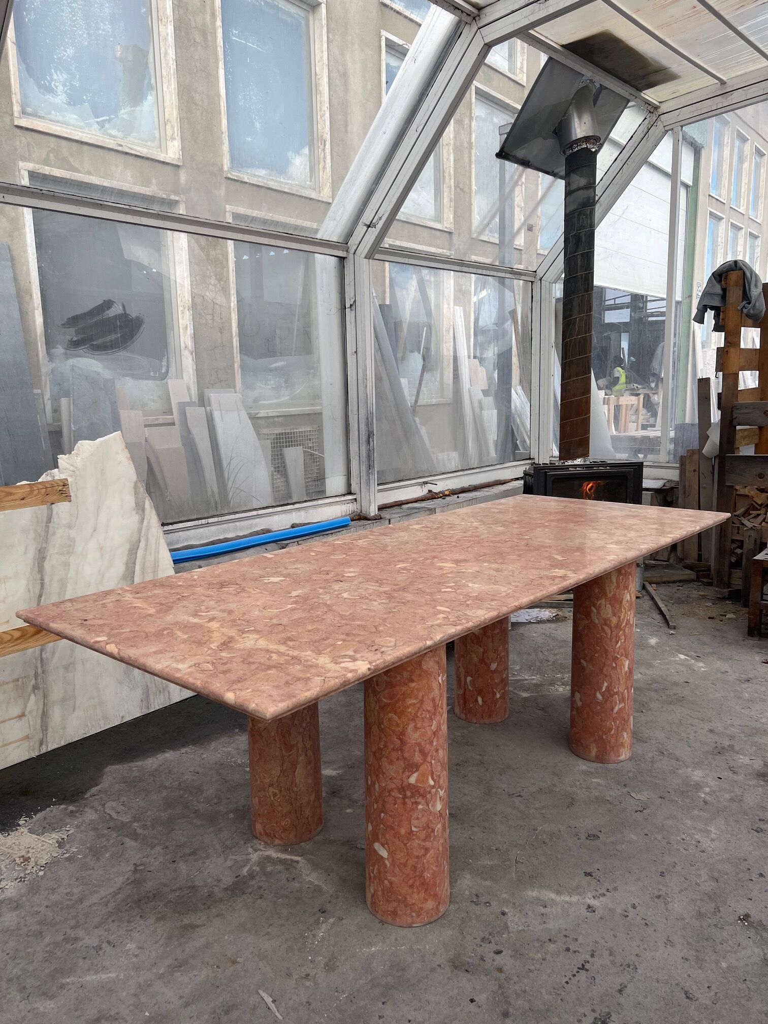 Large rectangle stone dining table in red/pink Portuguese Travertine