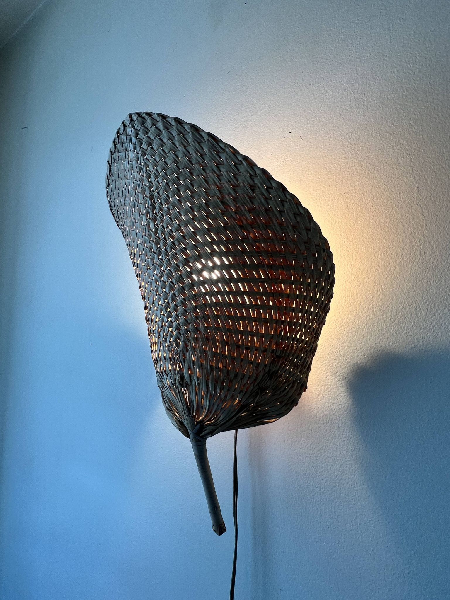 Woven rattan wall light in the style of Igno Maurer, design from the 1970s.