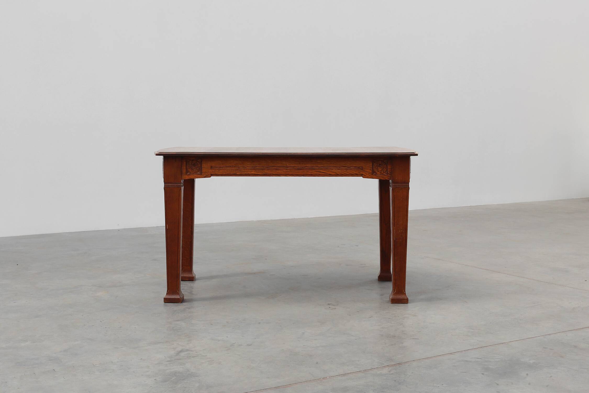 Oak Art Deco dining table with carved frieze, France 1920s