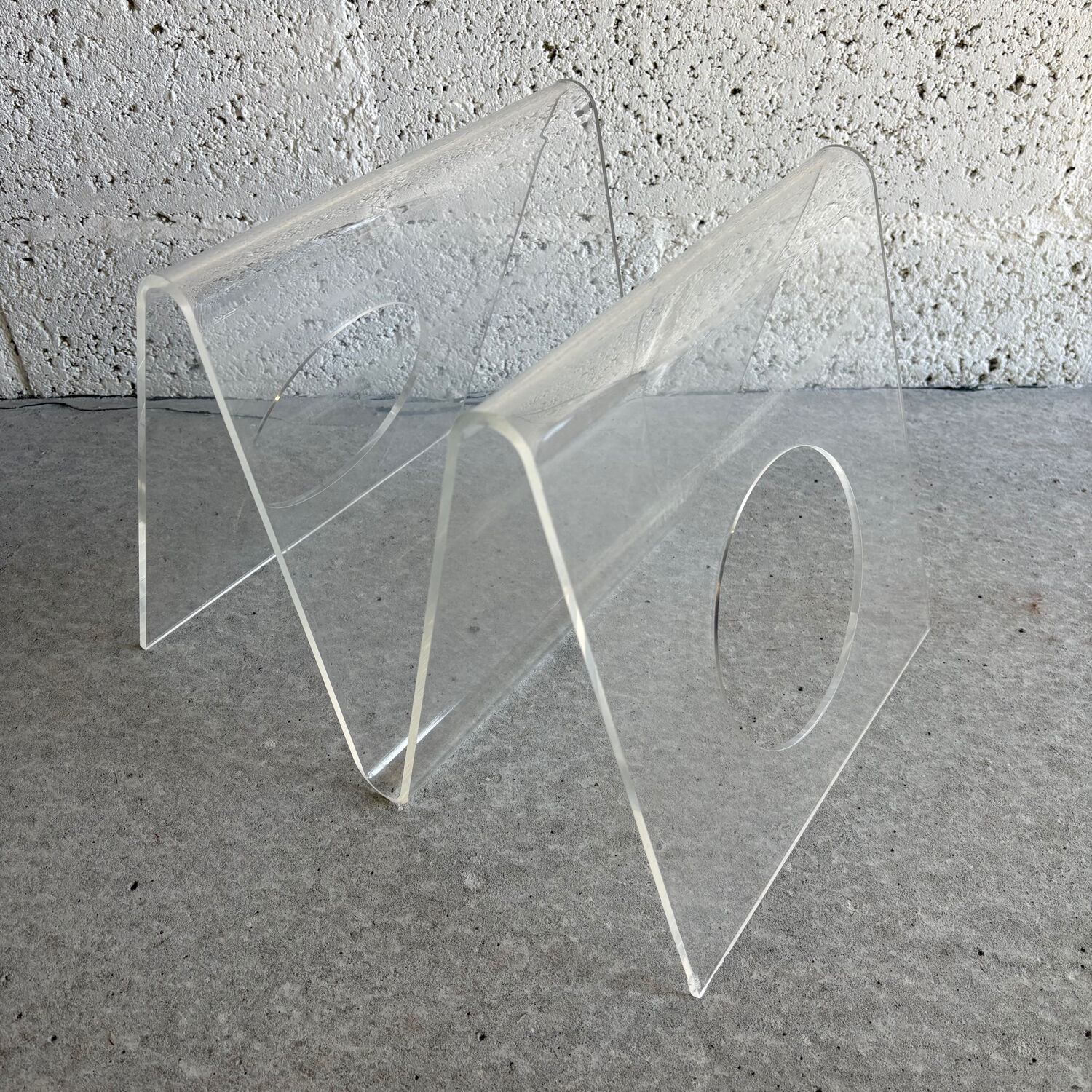 A Plexiglas magazine rack for Roche Bobois, 1970.