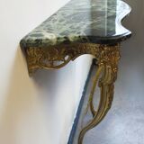 Bronze wall console and mirror.
