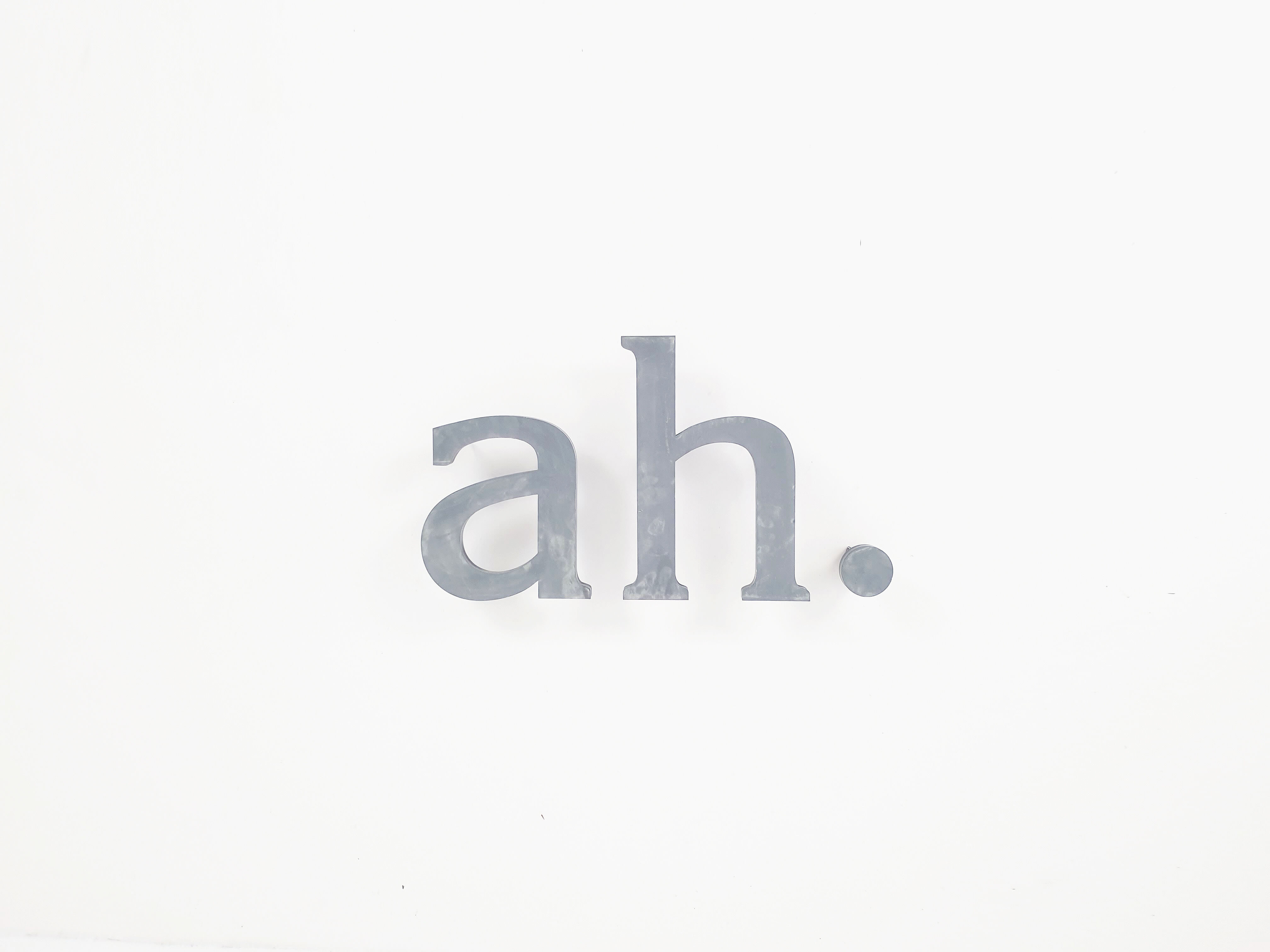 "Ah." sign letters from the patinated grey 70s
