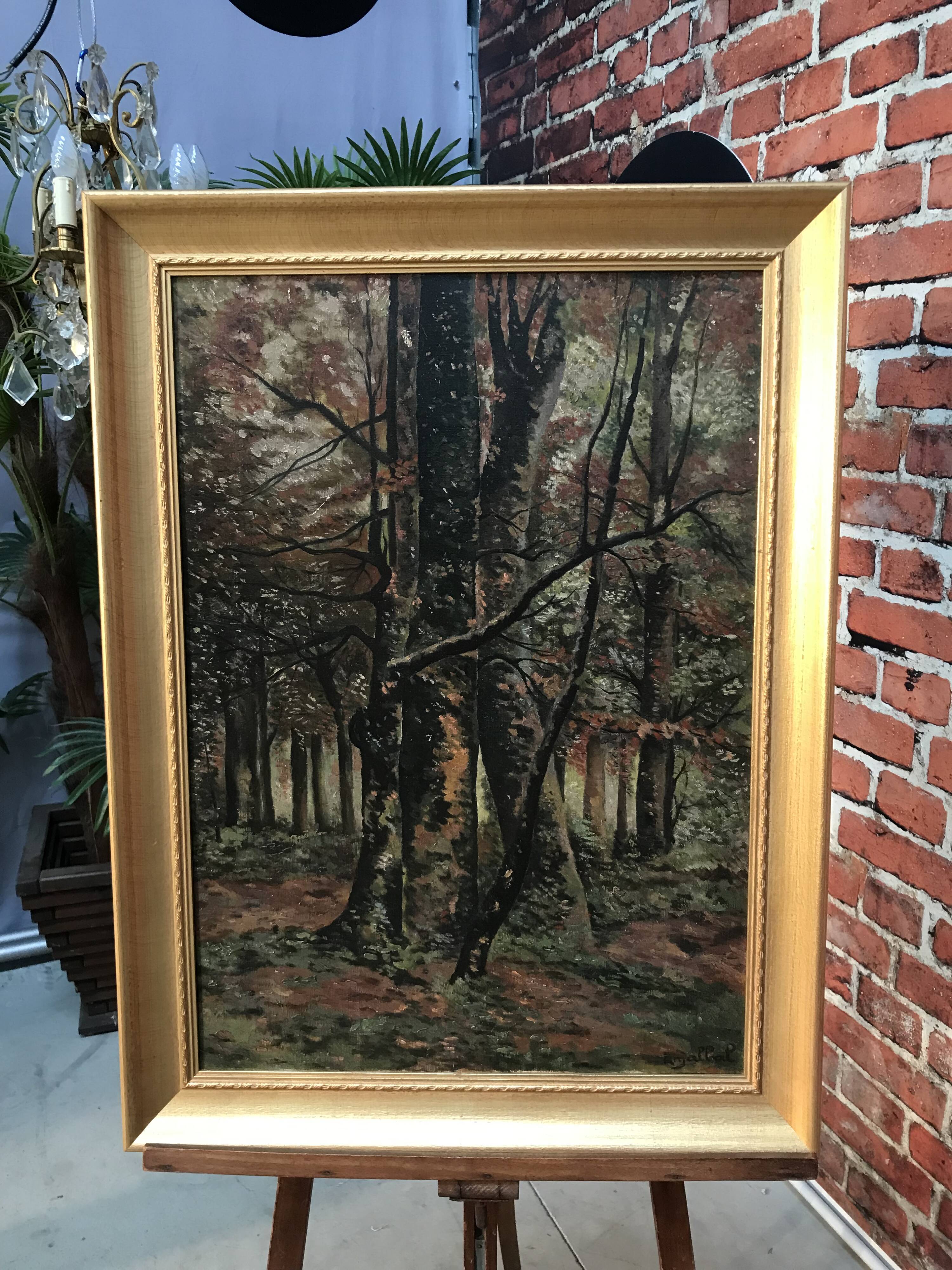 Framed painting depicting a forest