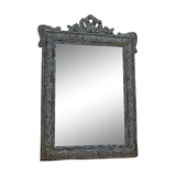 Chic and stylish antique mirror with carved wooden frame in whitewashed