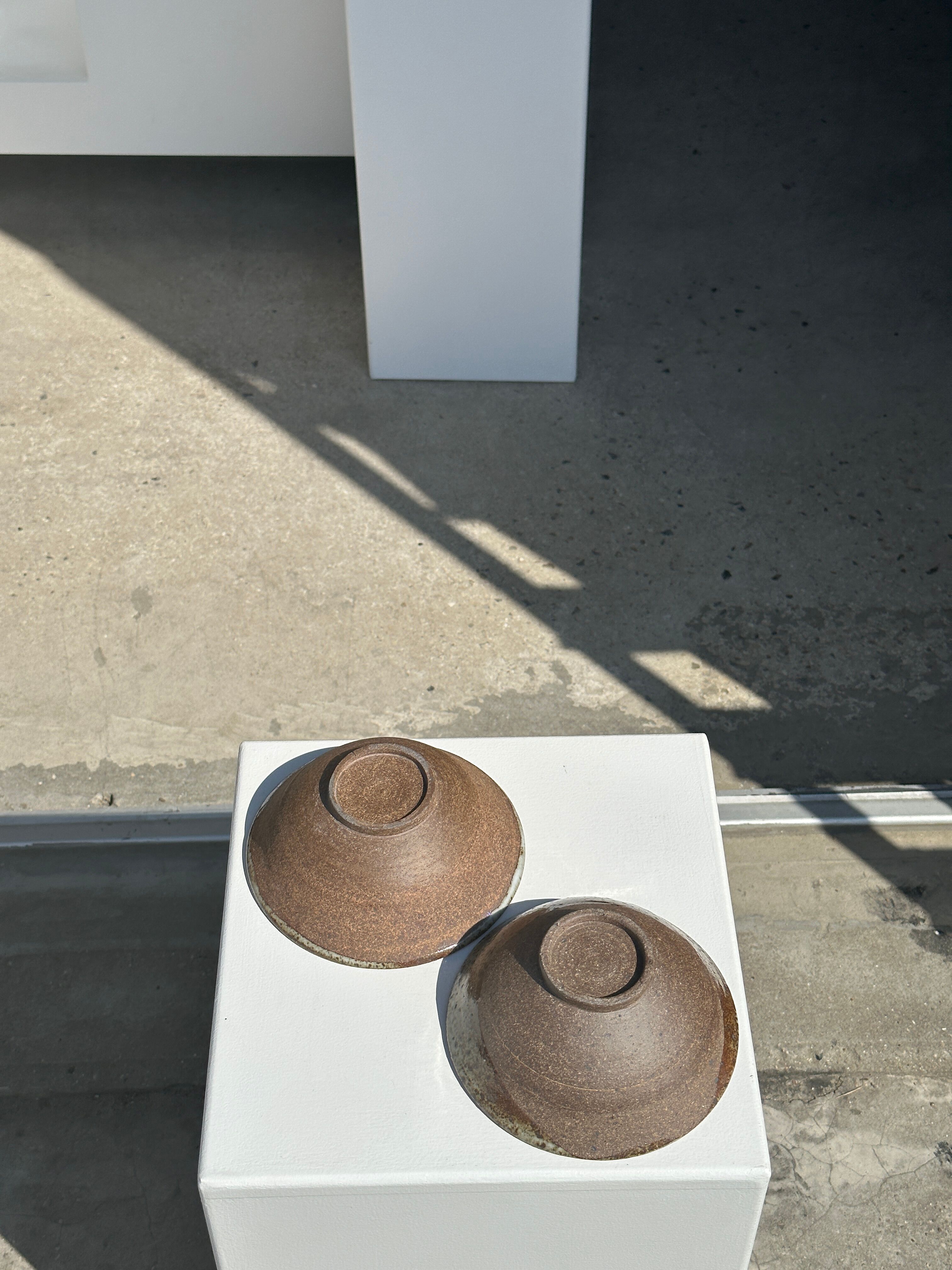 Duo of ceramic bowls interior glazed exterior matt raw earth
