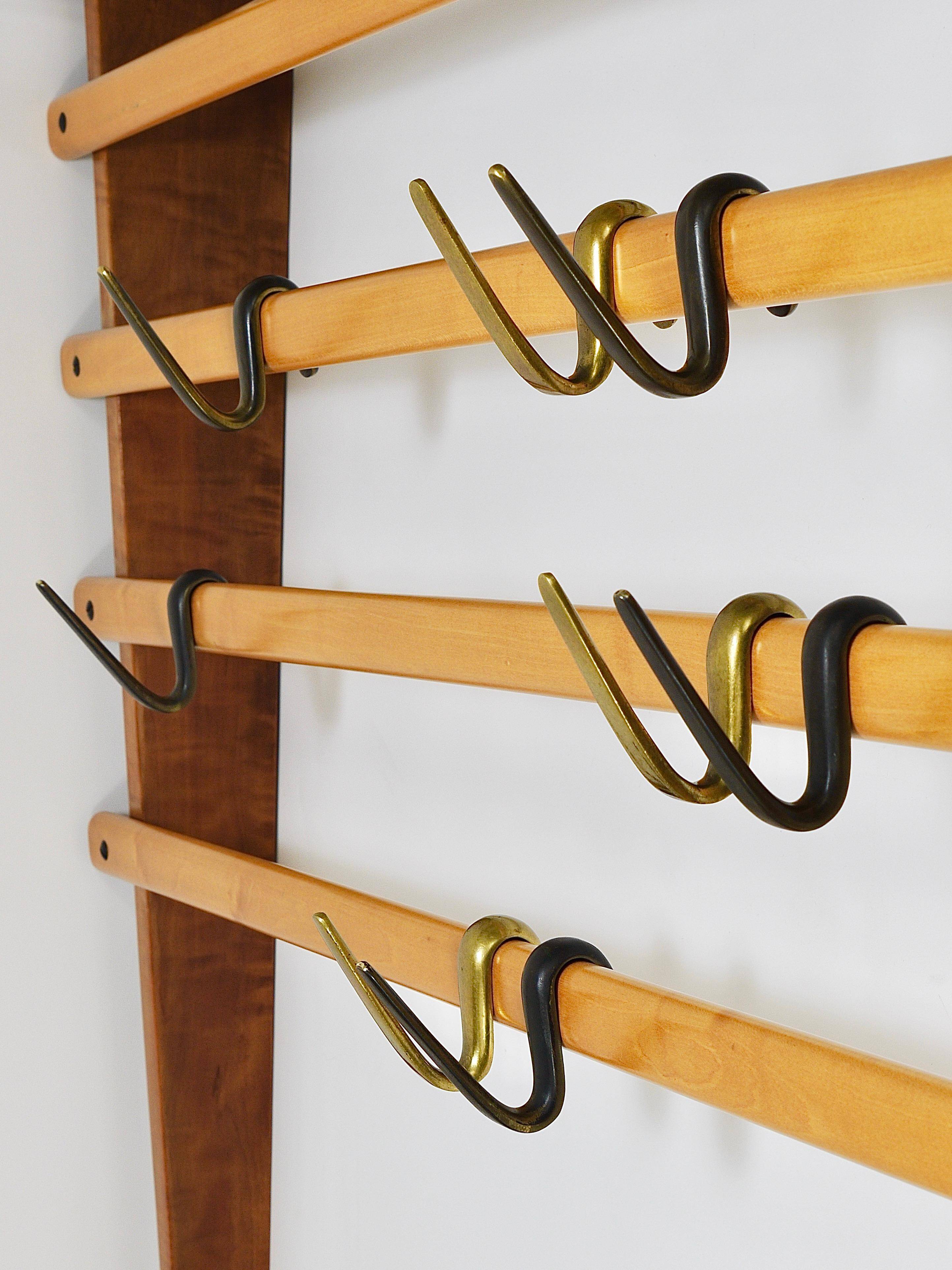 Rare coat rack by Carl Auböck with hat rack, cabinet, brass, walnut and beech, 1950s.