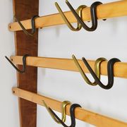 Rare coat rack by Carl Auböck with hat rack, cabinet, brass, walnut and beech, 1950s.
