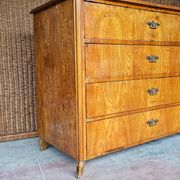 Large antique Biedermeier-style chest of drawers with wood grain.