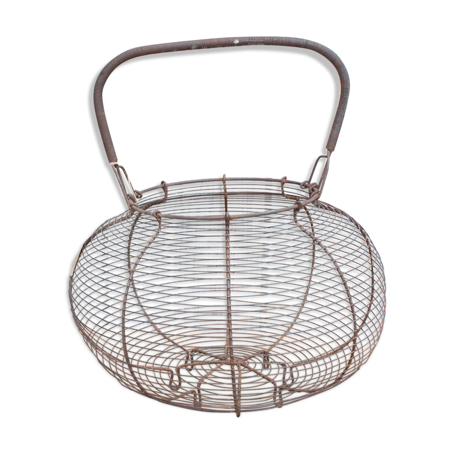 Old basket has wire eggs