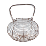 Old basket has wire eggs