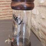 Vintage glass and wood whiskey bottle with pouring tap