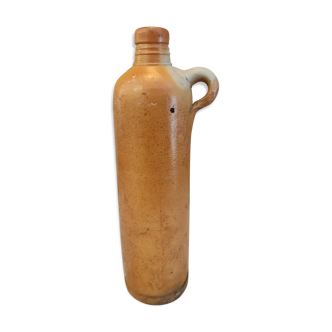 Old bottle in terracotta matte finish that can be used as a vase, soliflore