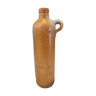 Old bottle in terracotta matte finish that can be used as a vase, soliflore