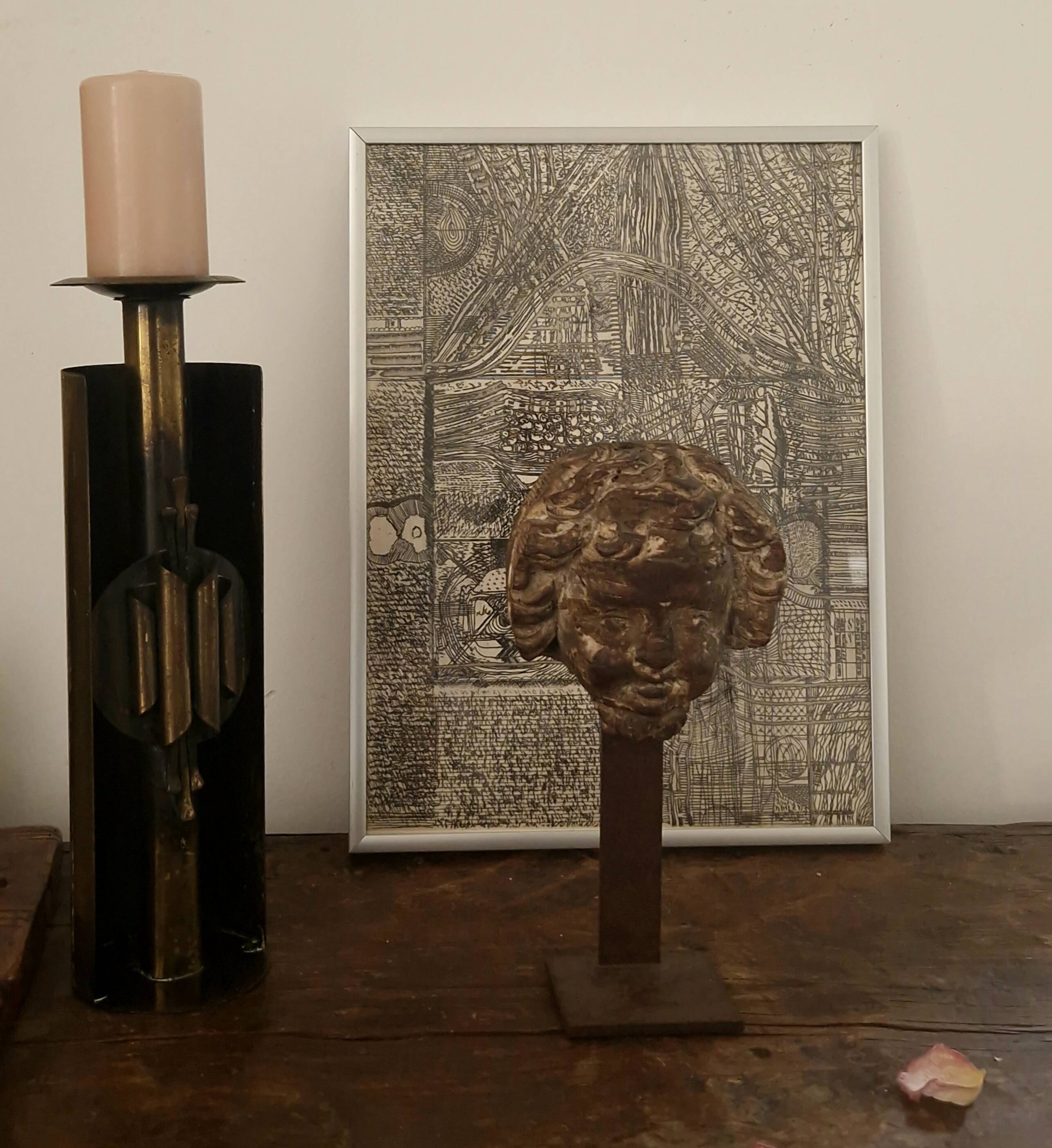 Sculpture. Ancient wooden angel head.