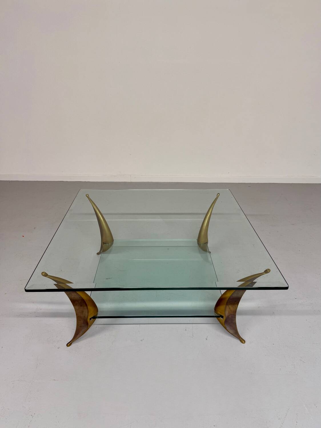 Glass coffee table with solid brass legs, Italian design from the 60s