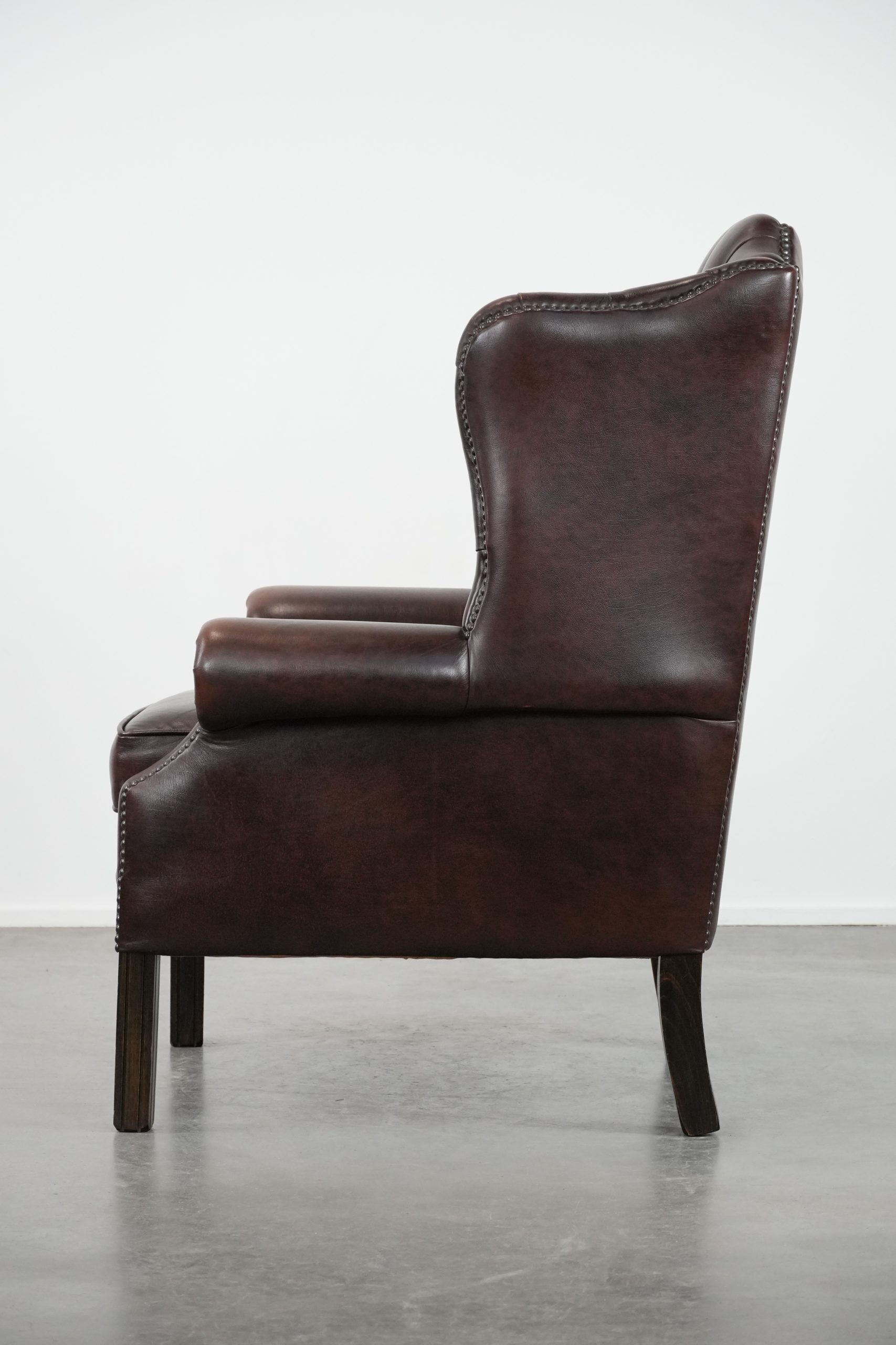 Brown cowhide leather Chesterfield wingback armchair in English style