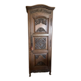 Antique wooden sideboard with engraved door