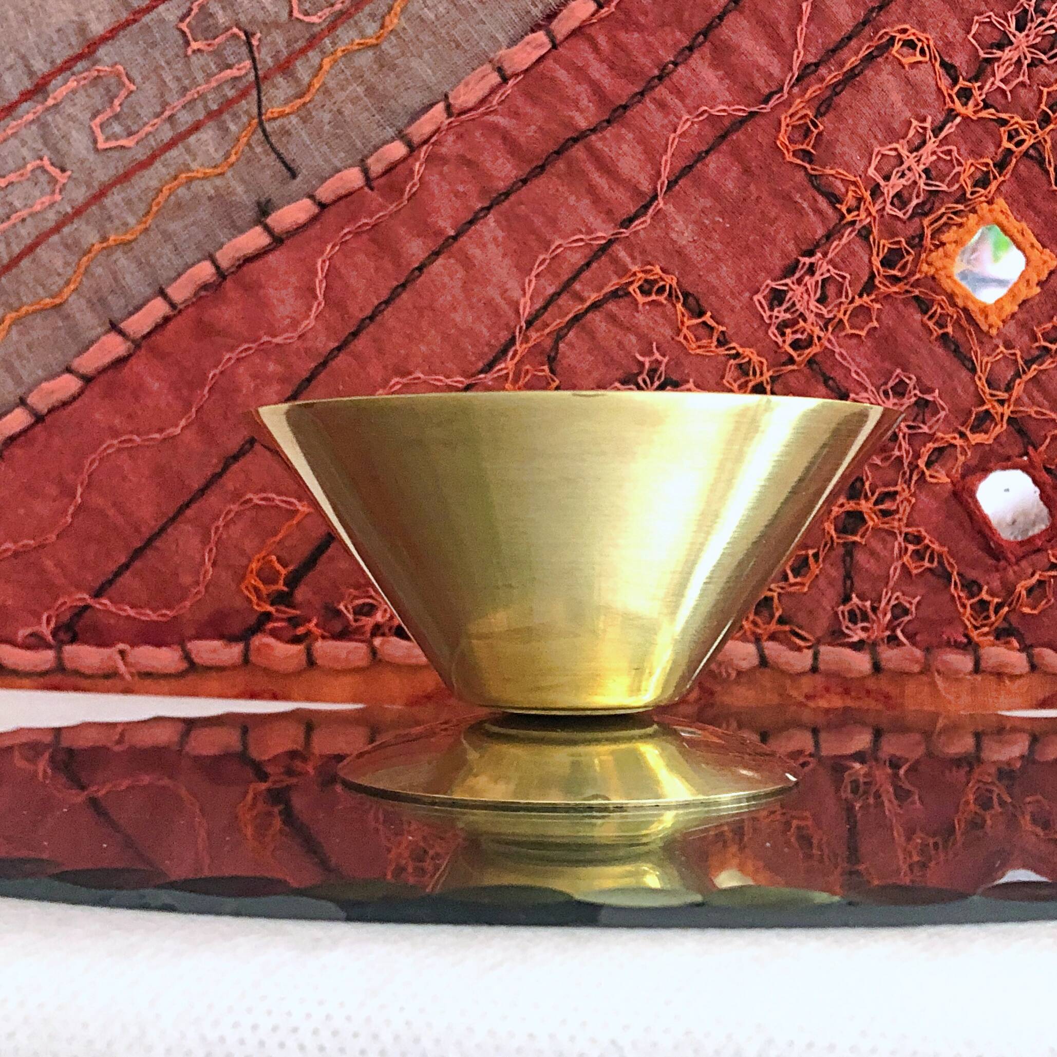 Table candle holder in golden brass