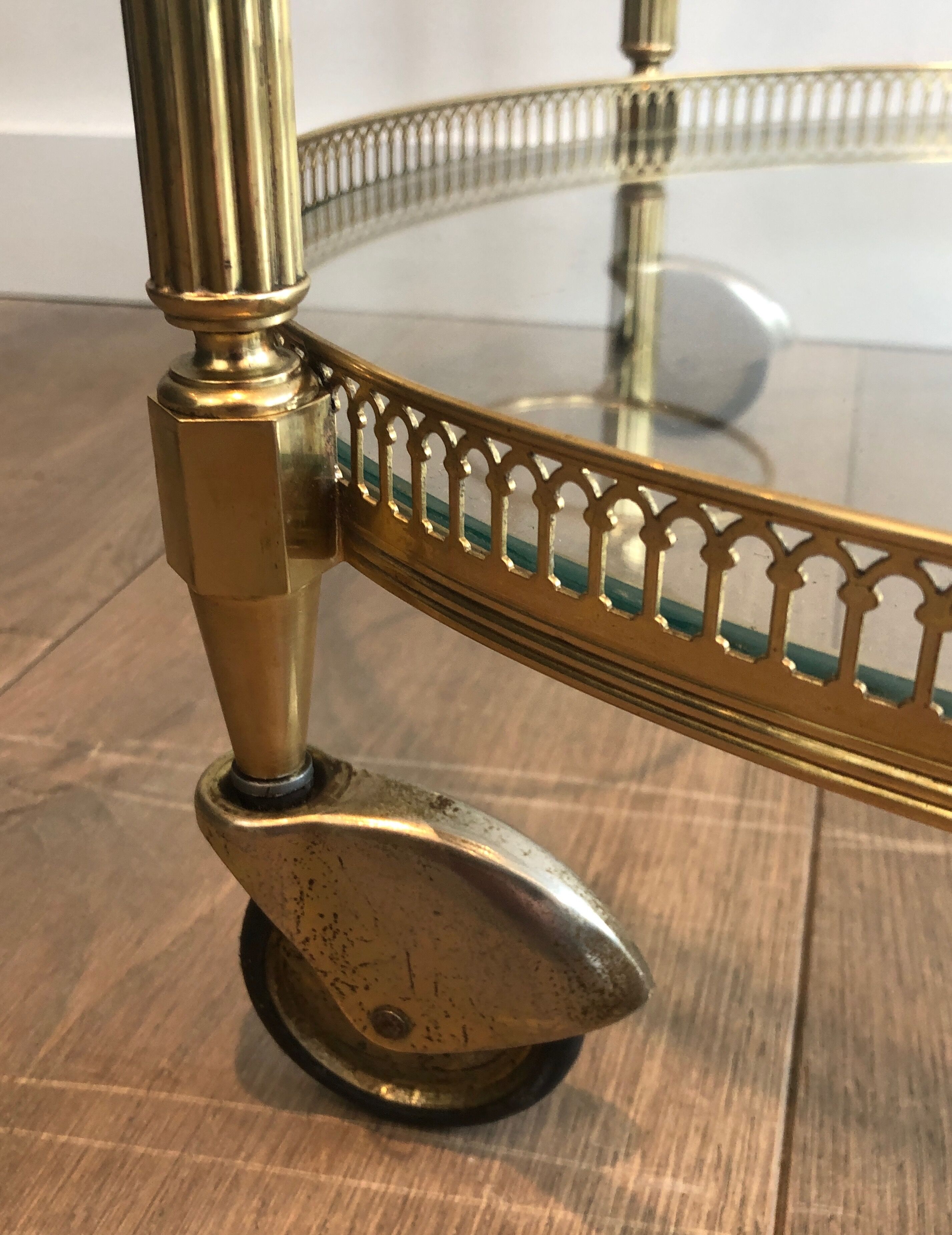 Neoclassical style rolling table in brass