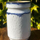 Pretty pot or vase in glazed stoneware with blue drip effect.