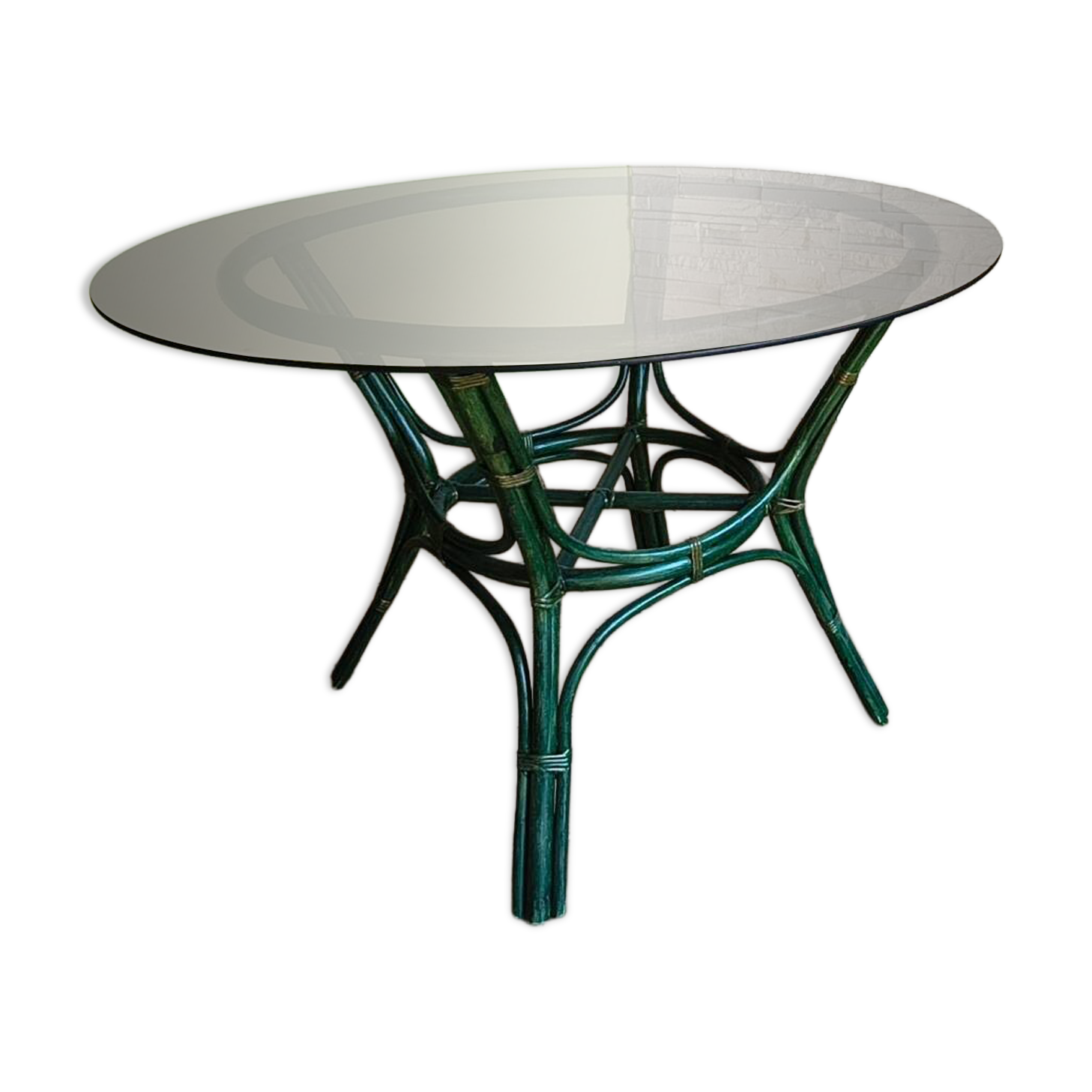 Round bamboo rattan table with a glass top.