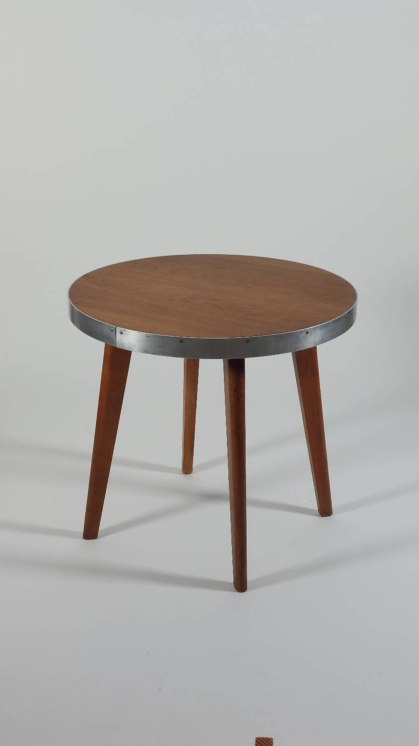 Vintage metal and teak side table from the 1950s.