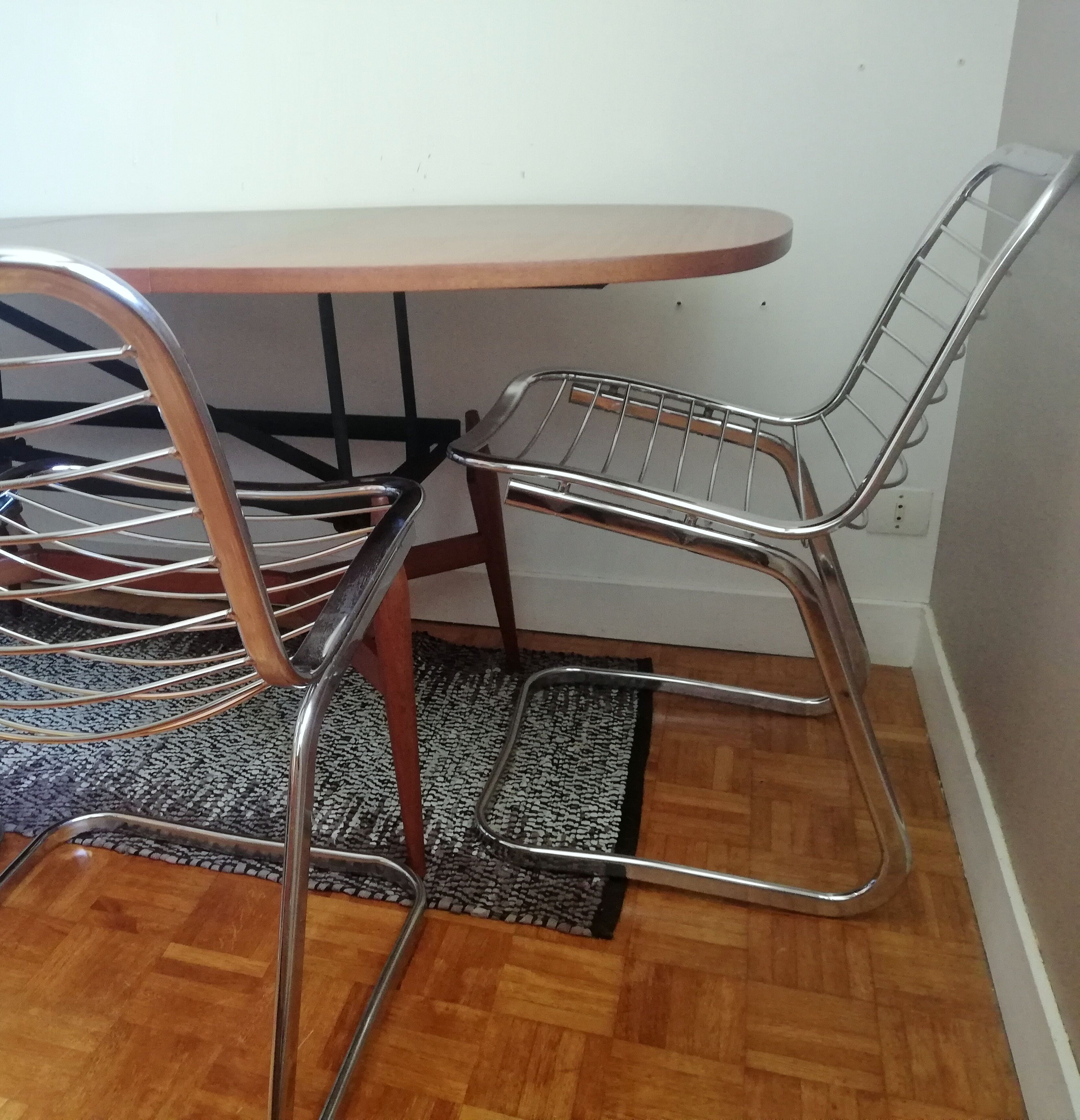 2 chrome wired chairs