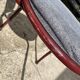 Metallic burgundy bistro chair for restaurants and communities with gray fabric