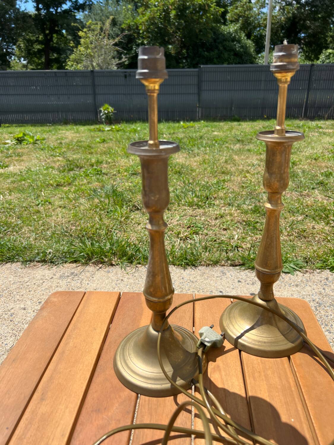 Two brass bedside lamps