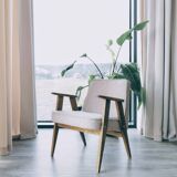 Vintage armchair in oak wood with powder pink boucle design by Chierowski.