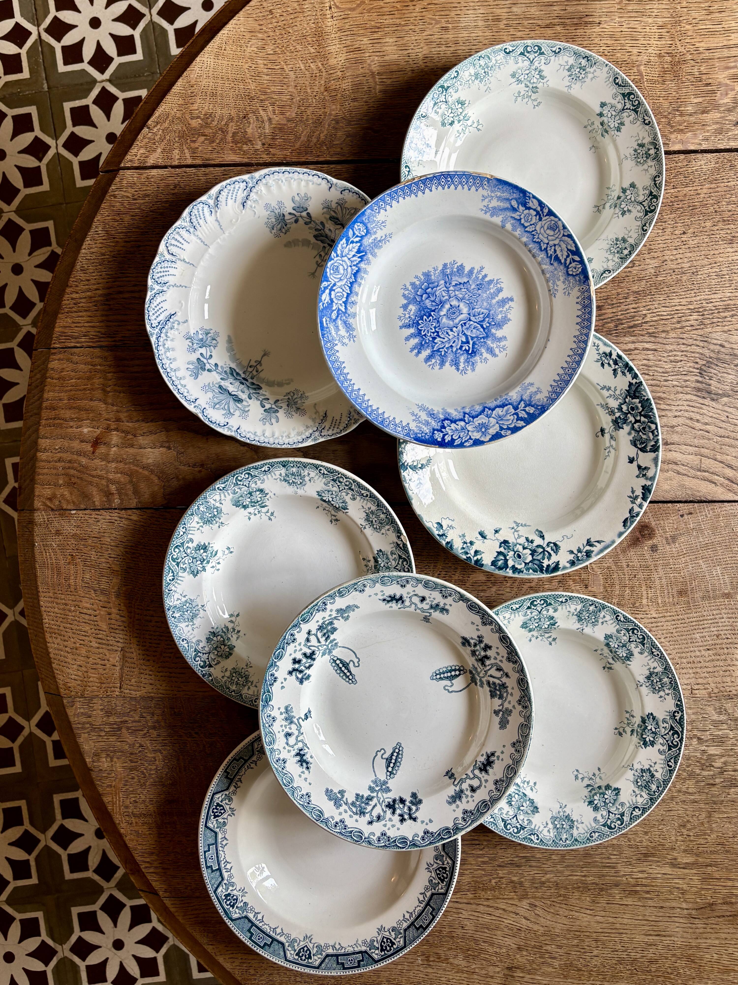 Set of 8 mismatched antique ironstone deep plates.