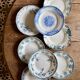 Set of 8 mismatched antique ironstone deep plates.