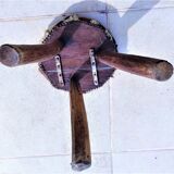 Rustic tripod stool seat covered with goatskin