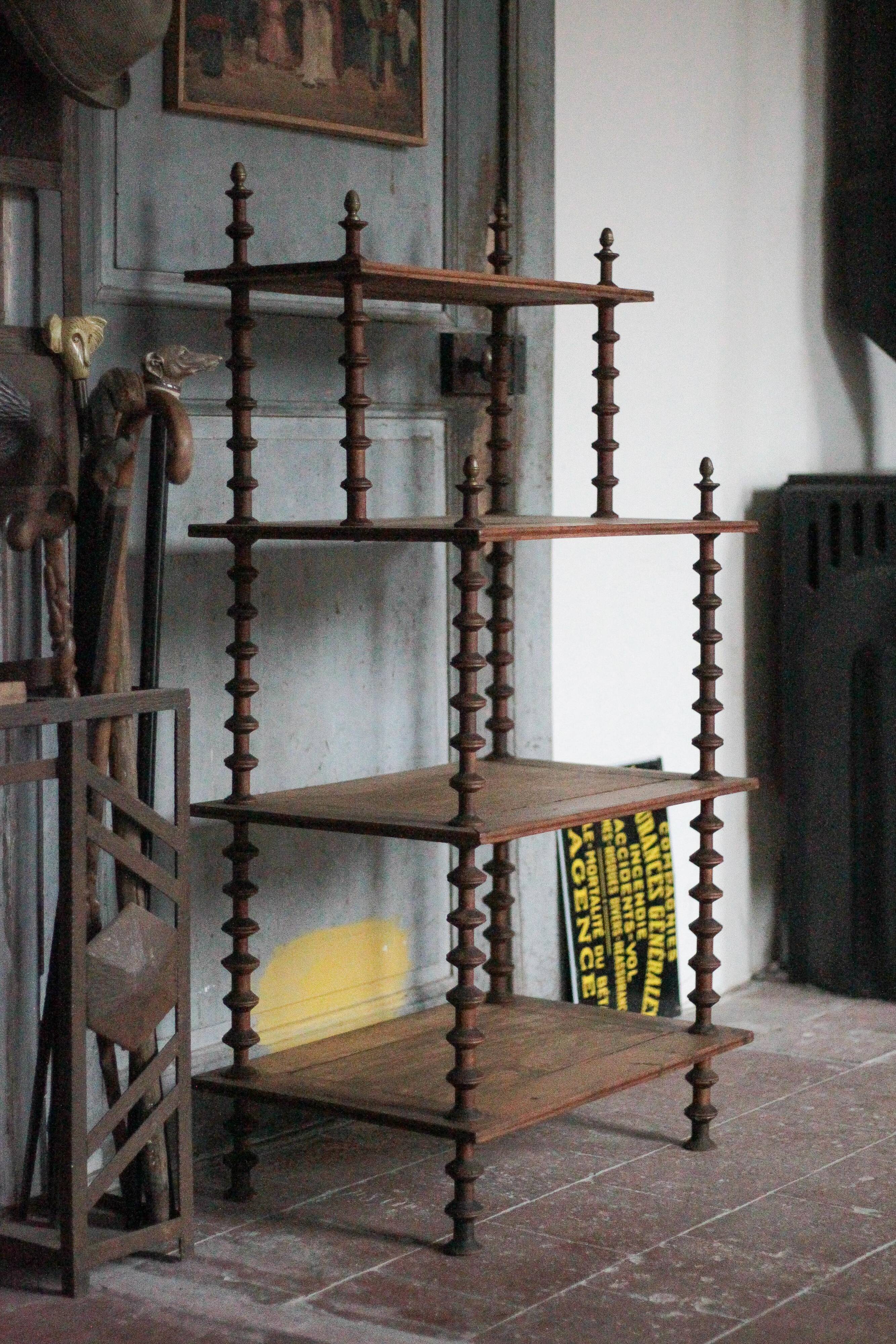 Napoleon III spool shelf, floor-standing shelf with brass tips.