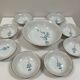 Vintage porcelain service: salad bowl and 8 small bowls.
