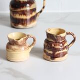 3 old bicoloured enamelled stoneware jugs