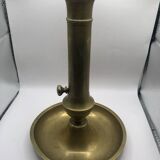 Candle holder with a pusher
