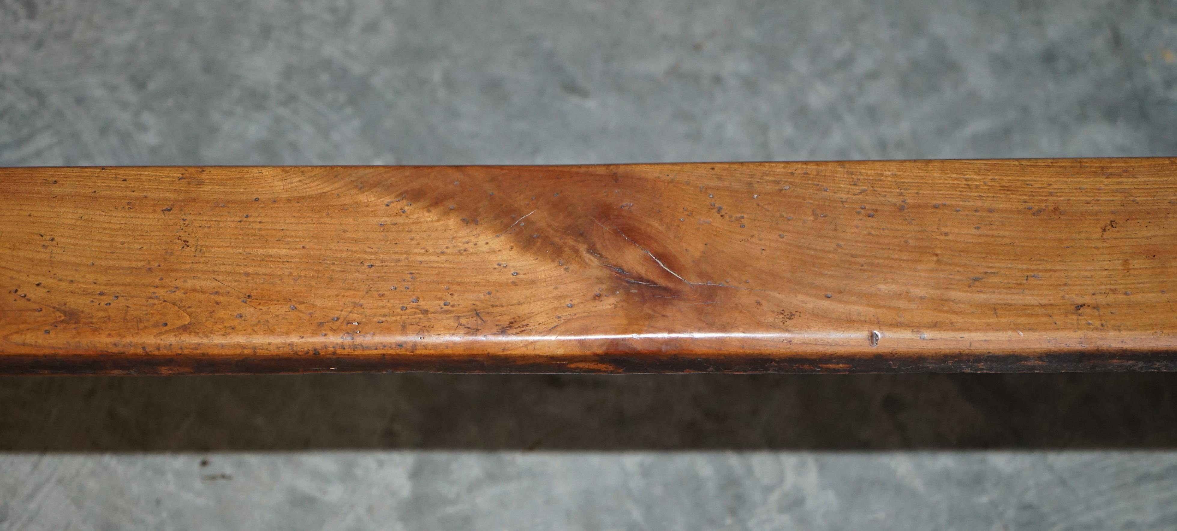 Pair of antique Victorian trestle benches in fruitwood.