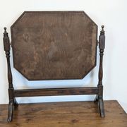 Antique beveled octagonal vanity mirror in carved wood