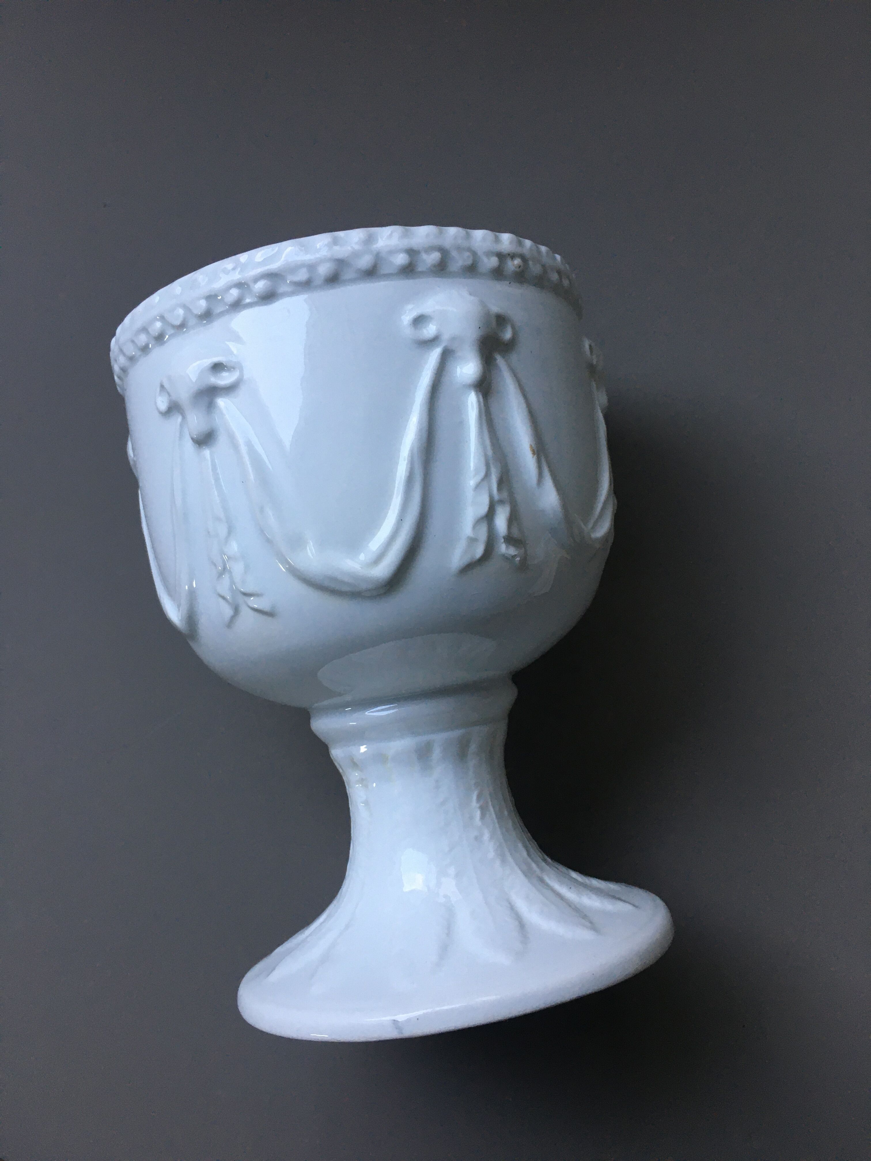 White chalice-cutting vase